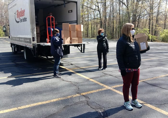 LifePath staff and volunteers load truck with PPE for delivery to home health workers. (photo courtesy of LifePath)